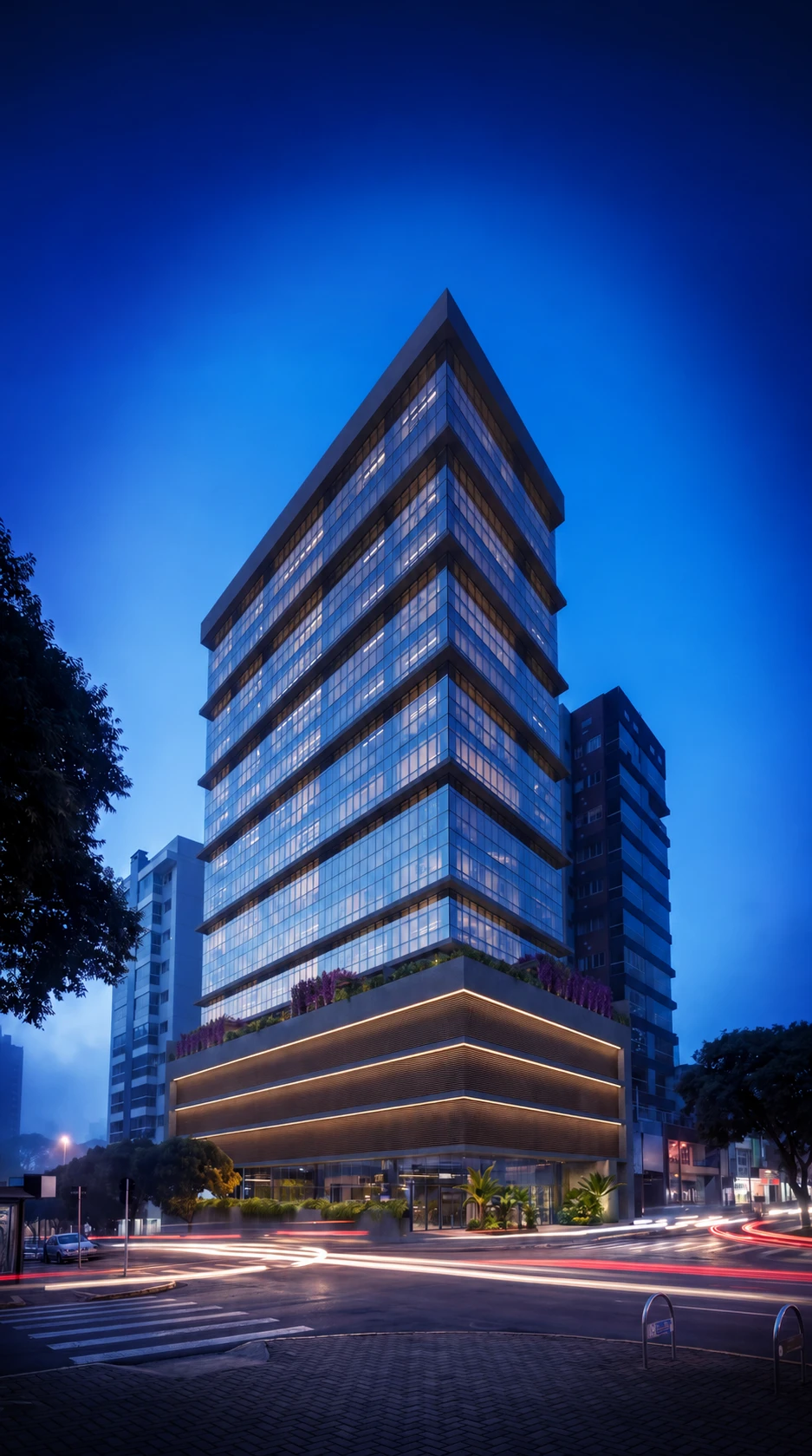 Perspectiva noturna de edifício corporativo com fachada envidraçada, linhas horizontais e base iluminada